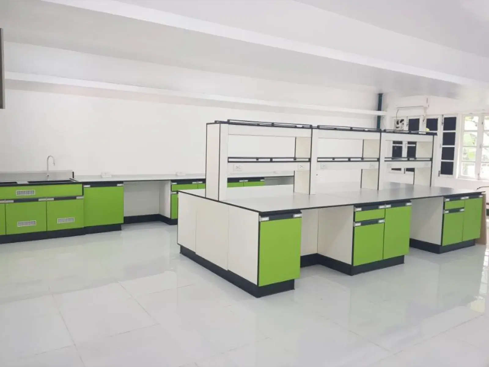 The rebuilt biotechnology laboratory — island and wall benches with new flooring