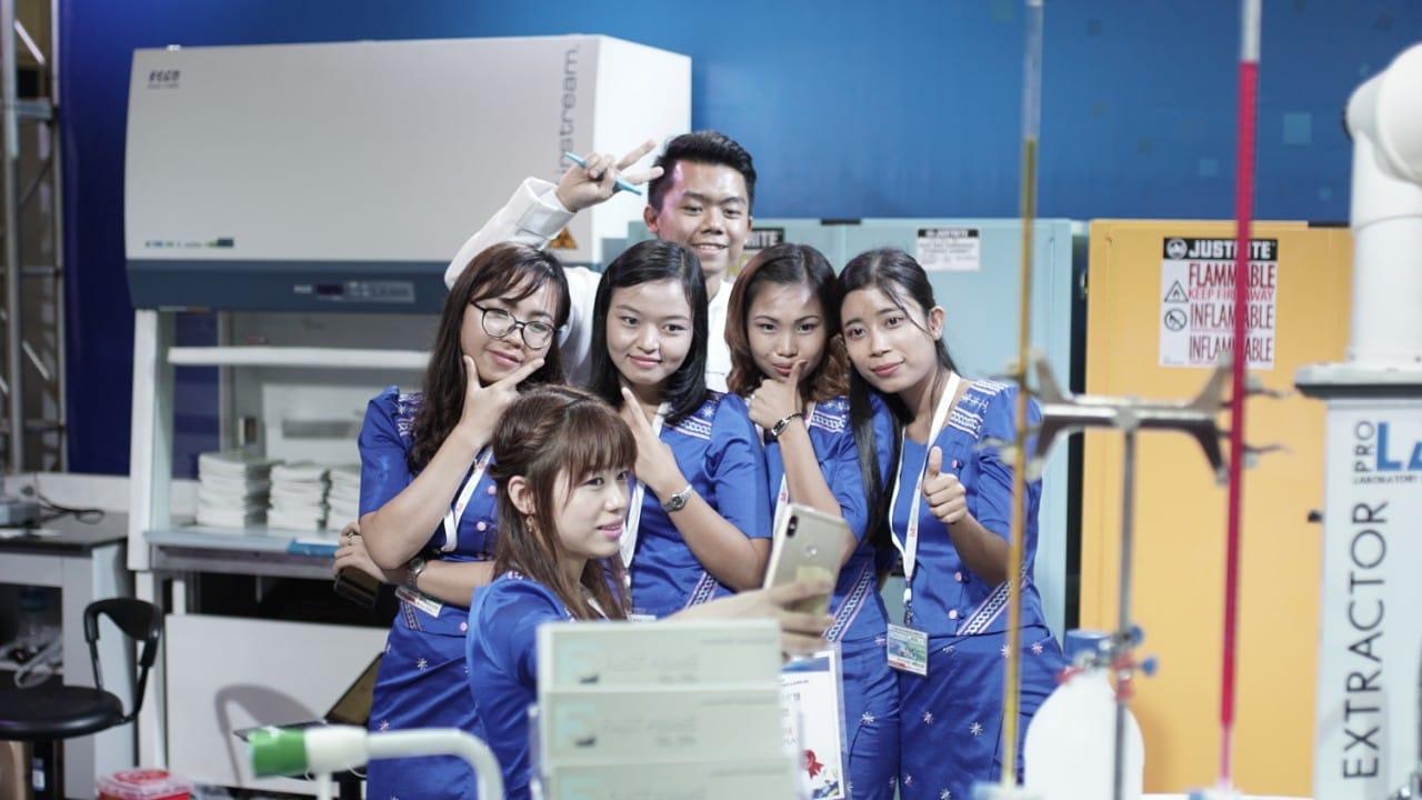 FIRST PRIME staff taking a group selfie in front of the biosafety cabinet